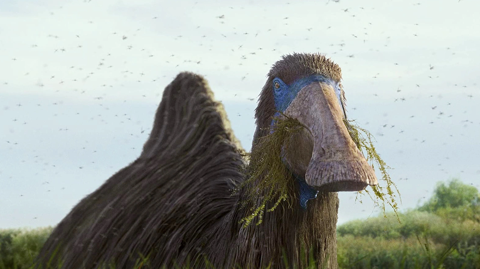 "Prehistoric Planet" screenshot showing a Deinocheirus happily munching on water plants.