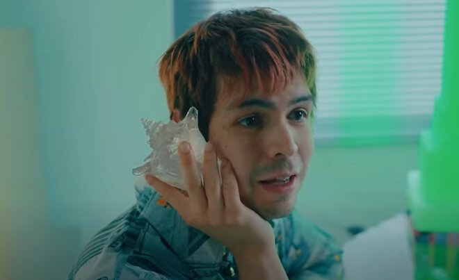 Julio Torres answers a crystal shell phone in promo clip for 'Problemista'