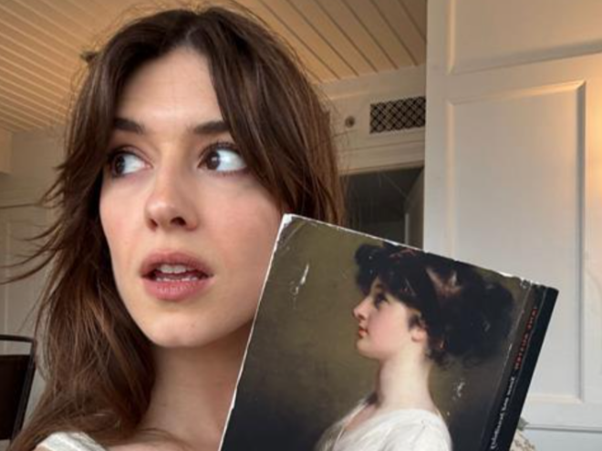 Daisy Edgar-Jones holds a copy of Jane Austen's 'Sense and Sensibility'