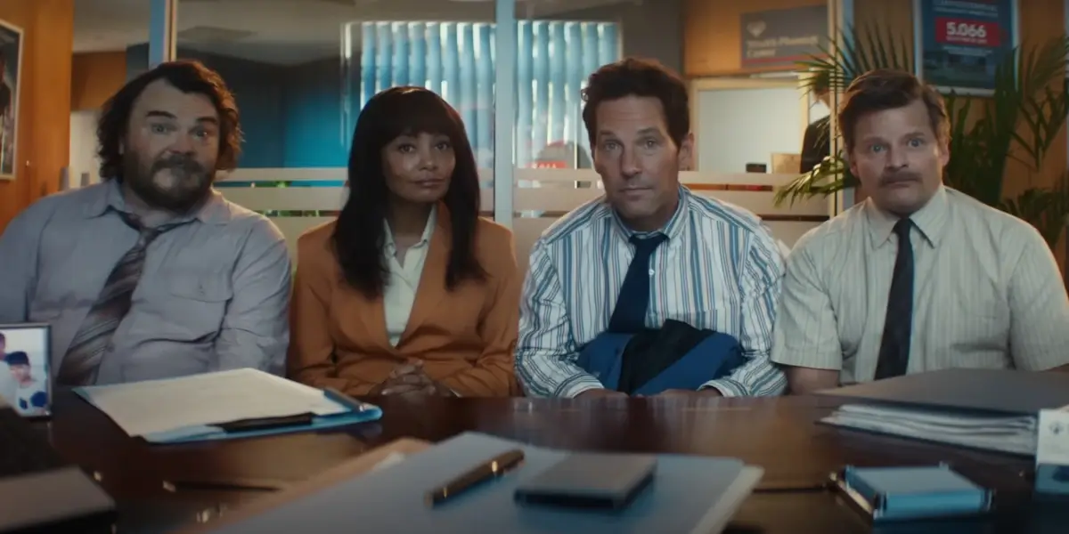 Jack Black, Thandiwe Newton, Paul Rudd, and Steve Zahn sit anxiously in a bank office in Anaconda.