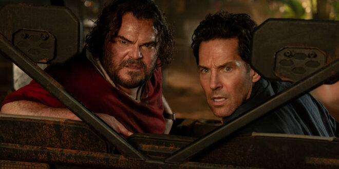 A frightened Jack Black and Paul Rudd look out of a truck cabin with concern in Anaconda.