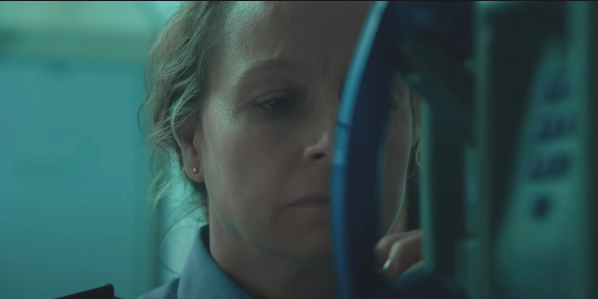 A forlorn Samantha Morton stares at a phone in Anemone.