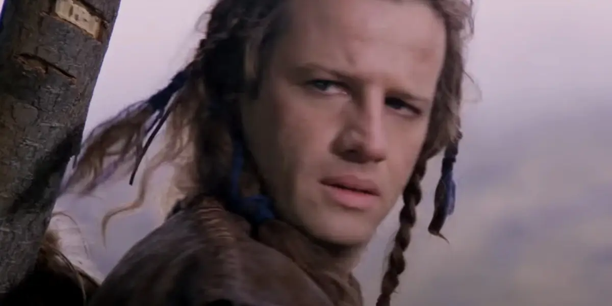 A curious Christopher Lambert looks over his shoulder in Highlander.
