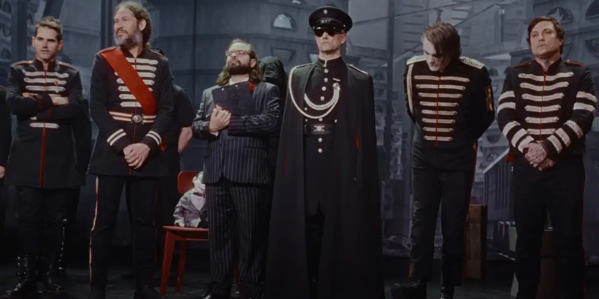 The Black Parade stands with The Clerk and The Grand High Immortal Dictator in the promo video for My Chemical Romance - The Black Parade 2026.