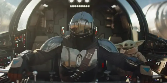 The Mandalorian and Grogu sitting at the controls of Razor Crest.