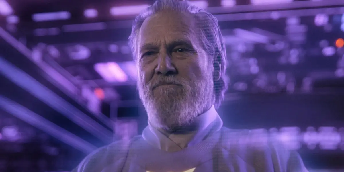 A glowing Jeff Bridges stands smiling on the Classic Grid in Tron: Ares.