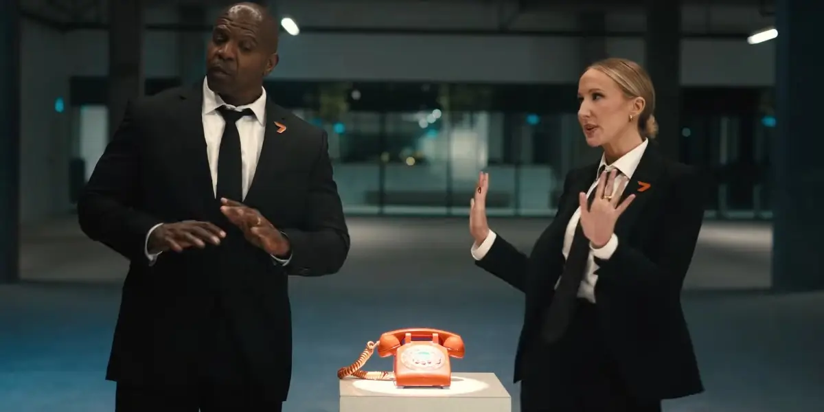 Terry Crews and Nikki Glazer stand near The Replacers phone in Call of Duty Black Ops 7's Launch Trailer.