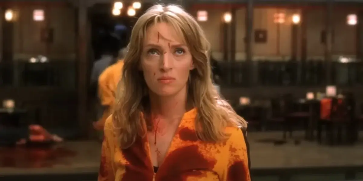 A blood-soaked Uma Thurman looks up defiantly in Kill Bill: Vol. 1.
