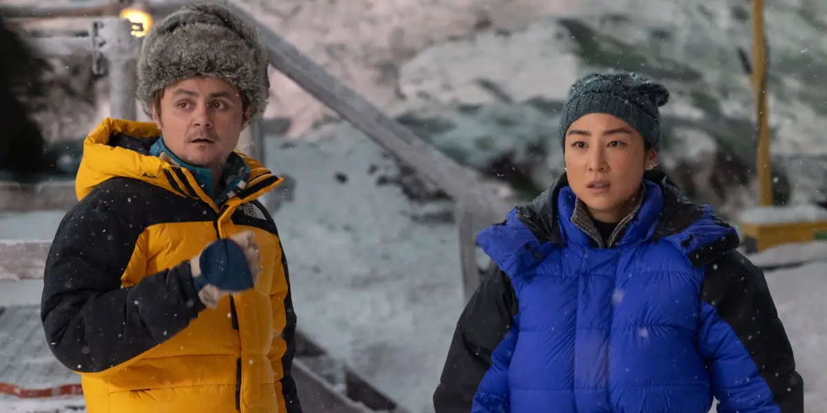 Tron Ares Arturo Casturo And Greta Lee Stare Ahead With Confusion In A Snowy Setting