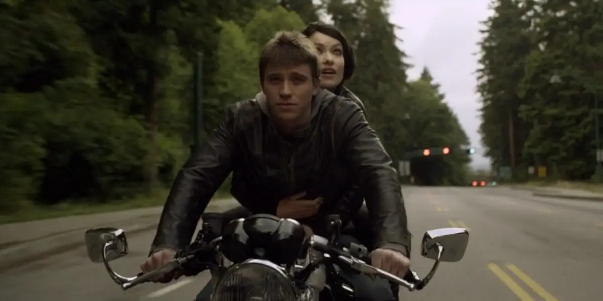 Tron Legacy Garrett Hedlund Drives His Motorcycle While Olivia Wilde Happily Observes The World Behind Him