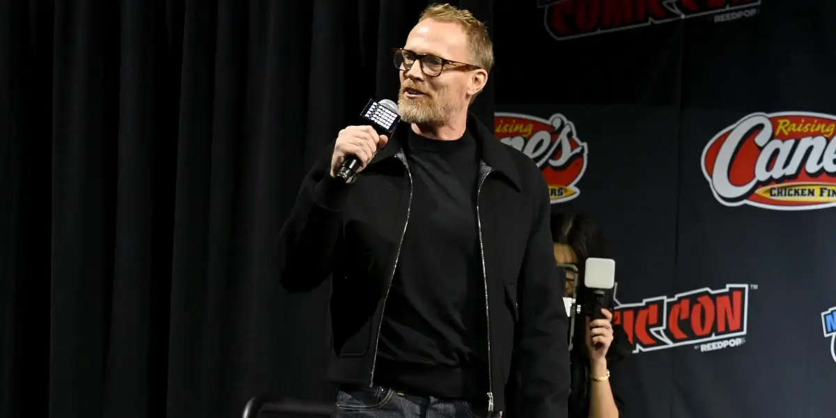 Paul Bettany hypes the crowd up while standing on stage at New York Comic Con 2025 for Vision Quest.