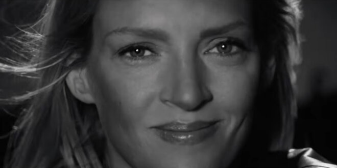 Uma Thurman smiles in black and white in the trailer for Kill Bill: The Whole Bloody Affair.