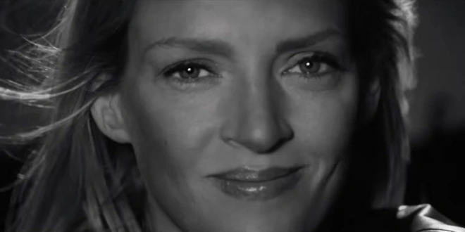 Uma Thurman smiles in black and white in the trailer for Kill Bill: The Whole Bloody Affair.