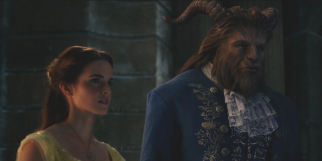 Emma Watson and Dan Stevens' Beast stand together on a balcony in Beauty and the Beast (2017).