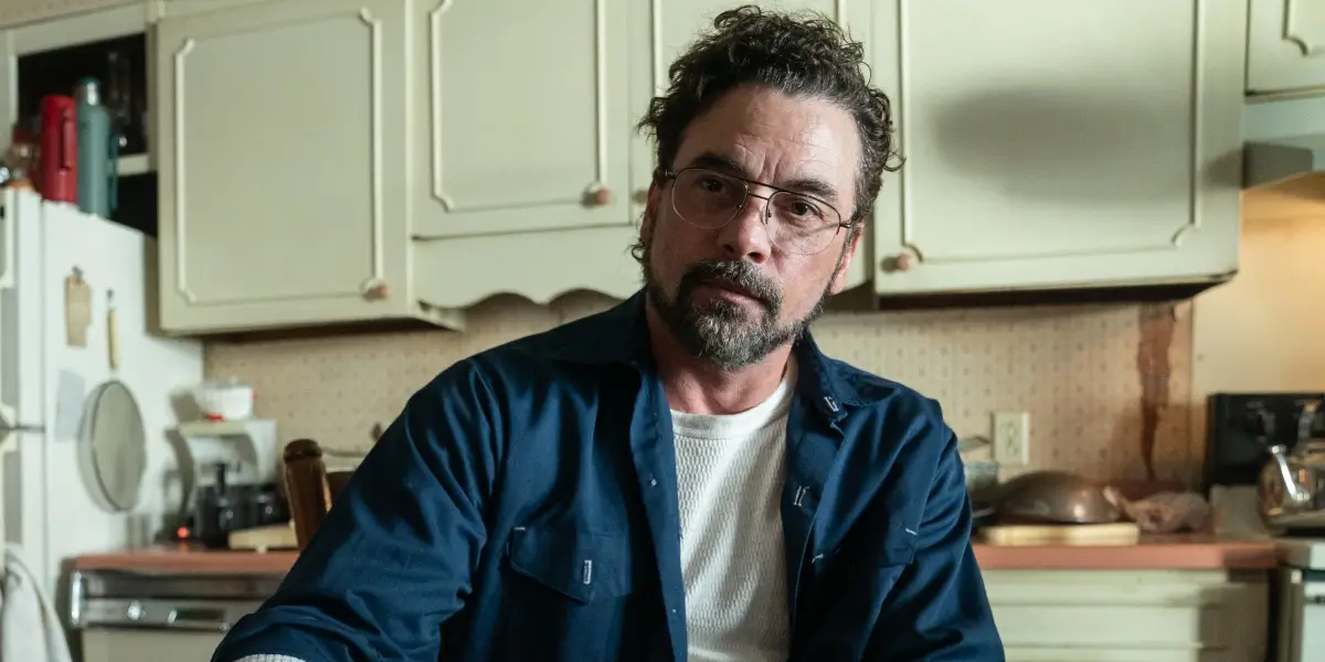 Skeet Ulrich sits wearily at his kitchen table in Five Nights At Freddy's 2.