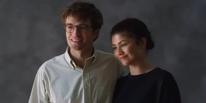 Robert Pattinson smiles weakly next to a reluctant Zendaya in The Drama.
