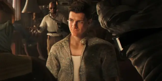 Patrick Gibson looks up at masked opponents with a smirk in 007 First Light.