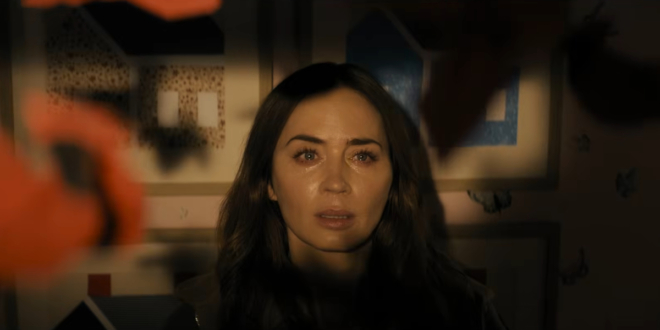A teary eyed Emily Blunt stares at a mobile with awe in Disclosure Day.