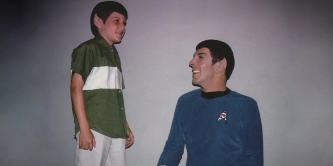 Young Adam Nimoy proudly wears Spock ears in front of a fully costumed Leonard Nimoy, in the For The Love Of Spock trailer.