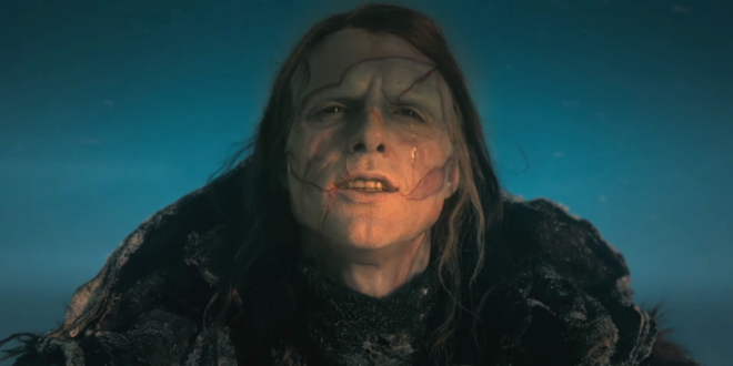 Jacob Elordi stands in the sun crying in full makeup and costume in Frankenstein.