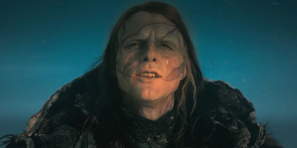 Jacob Elordi stands in the sun crying in full makeup and costume in Frankenstein.