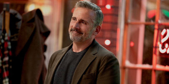 Steve Carell smiles bittersweetly in a well lit room in Rooster.