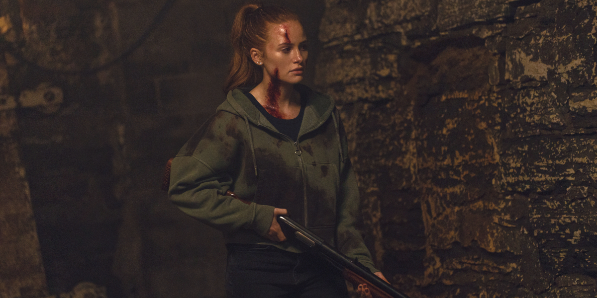 Madeline Petsch looks ahead while holding a shotgun in The Strangers: Chapter 3.