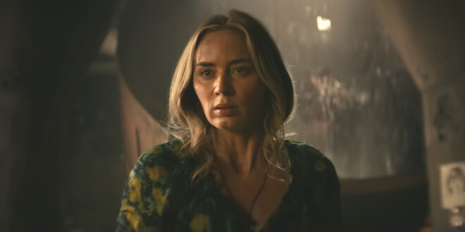 Emily Blunt stands frightened as a Death Angel emerges behind her in A Quiet Place Part II.