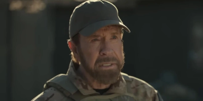 Chuck Norris stands outside in conversation in Agent Recon.