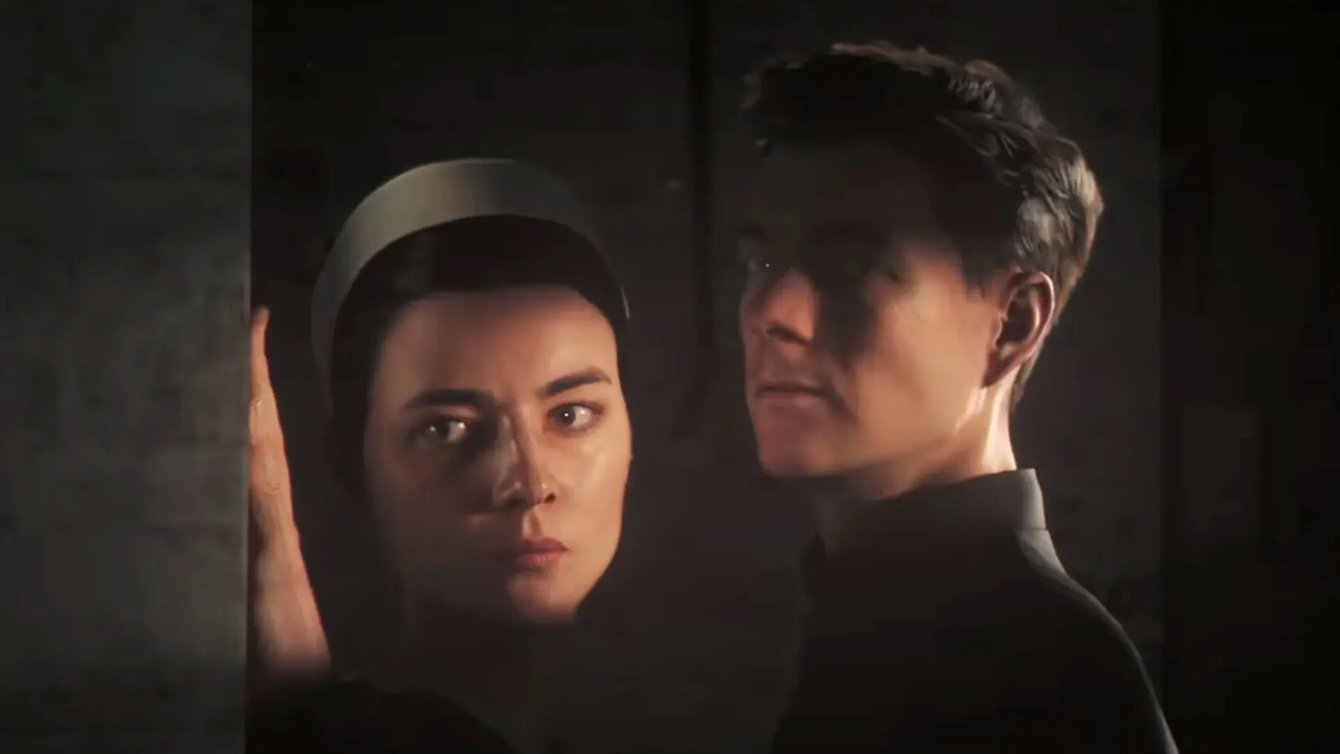 Noémie Nakai and Patrick Gibson hide close together in 007 First Light.