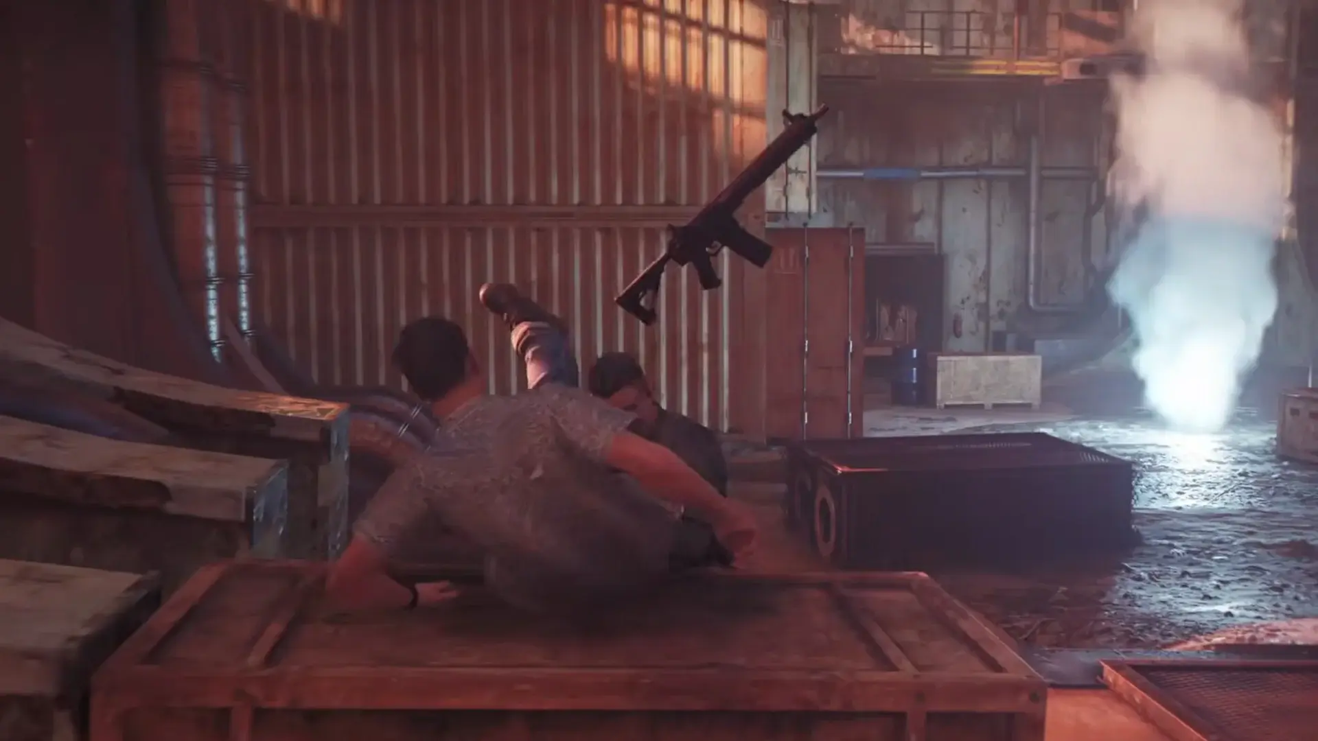 Patrick Gibson kicks a henchman's gun away while vaulting over a crate in 007 First Light.
