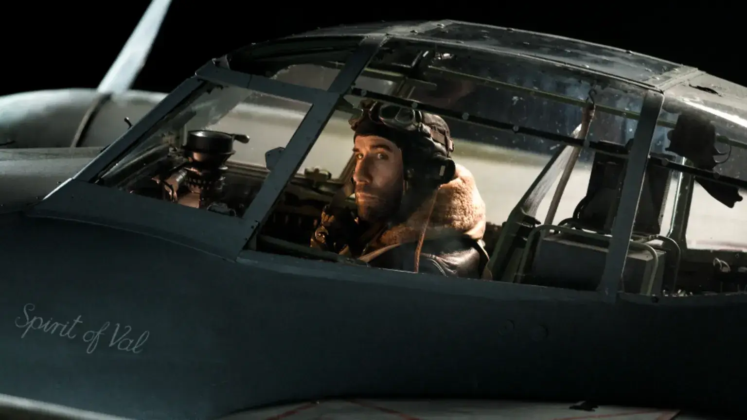 John Travolta in a cockpit of a plane.