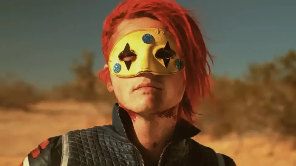 A masked Gerard Way stands defiantly in the desert in the video for Danger Days' "Na Na Na."
