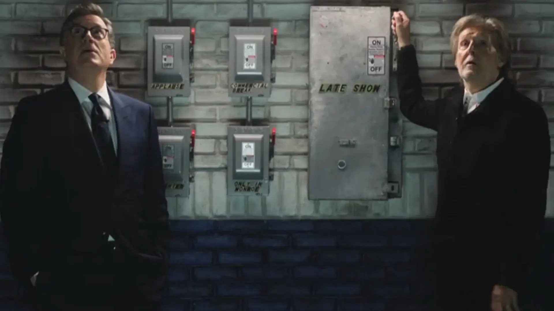 Stephen Colbert and Sir Paul McCartney look up while preparing to throw the switch in The Late Show with Stephen Colbert's finale.