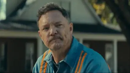 Matthew Lillard sits with a half smile of concern in The Life of Chuck.