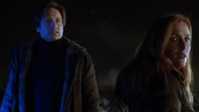 David Duchovny and Gillian Anderson stand together in disbelief on a cold night in The X-Files: I Want to Believe.