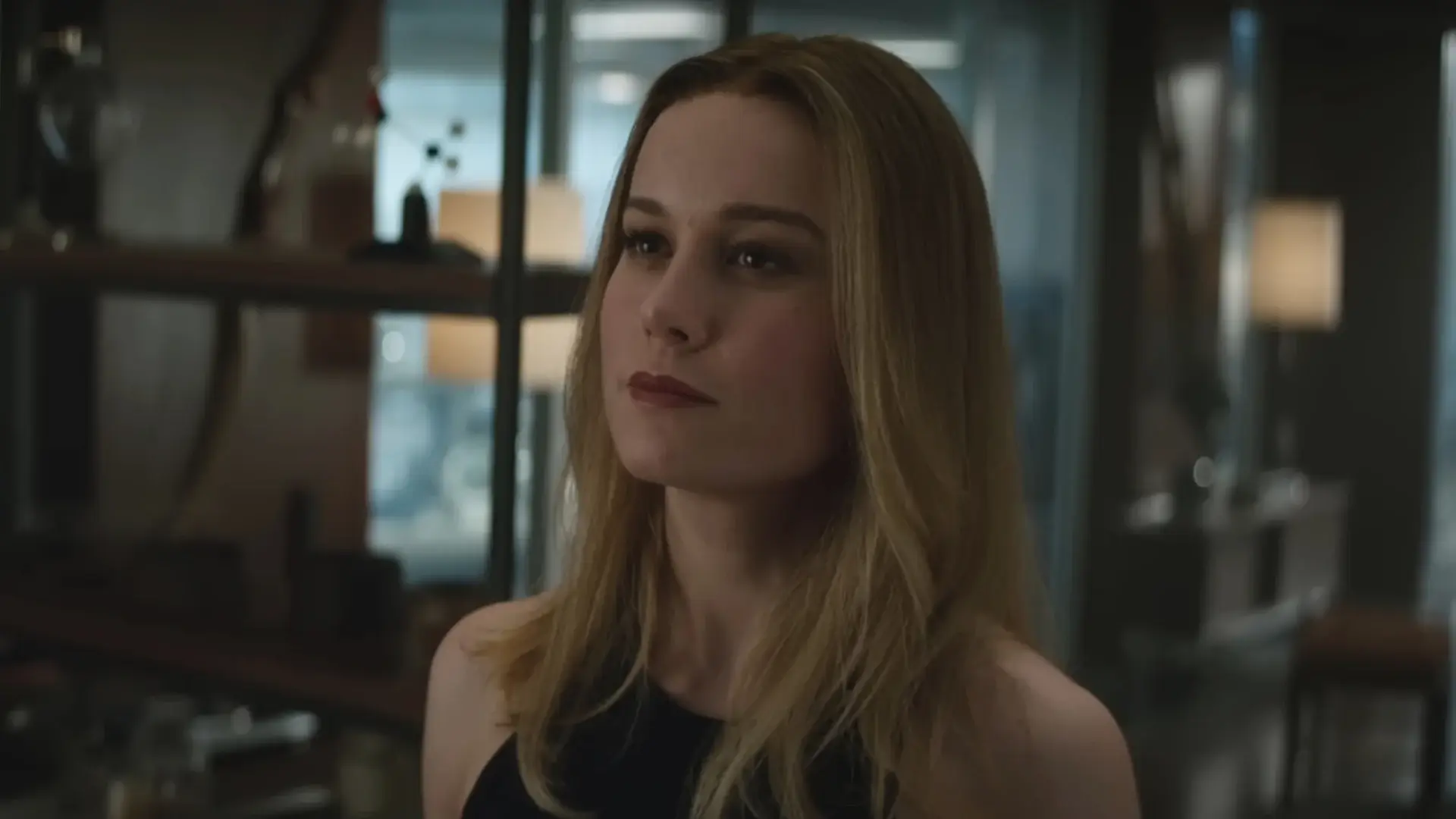 Brie Larson looks up with a face of friendly defiance in Avengers: Endgame.