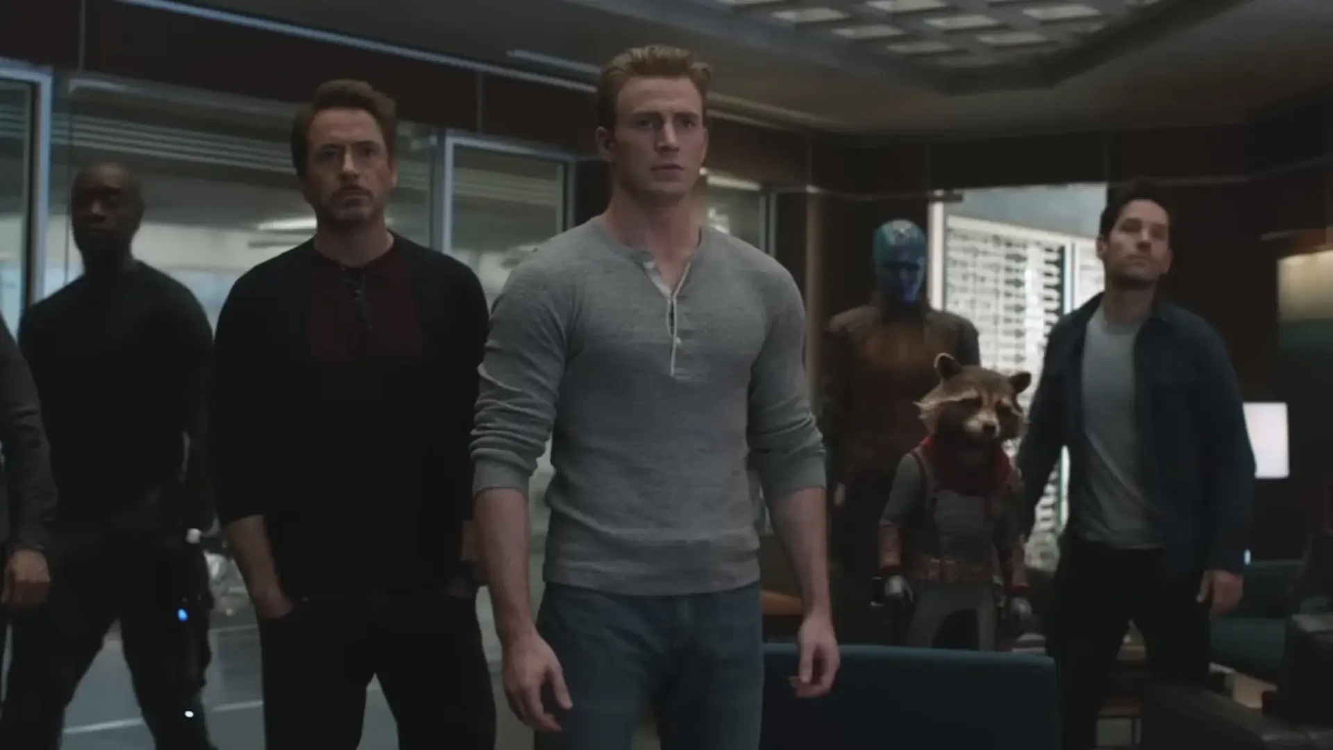 Chris Evans stands in front of his teammates in an Avengers Campus office in Avengers: Endgame.