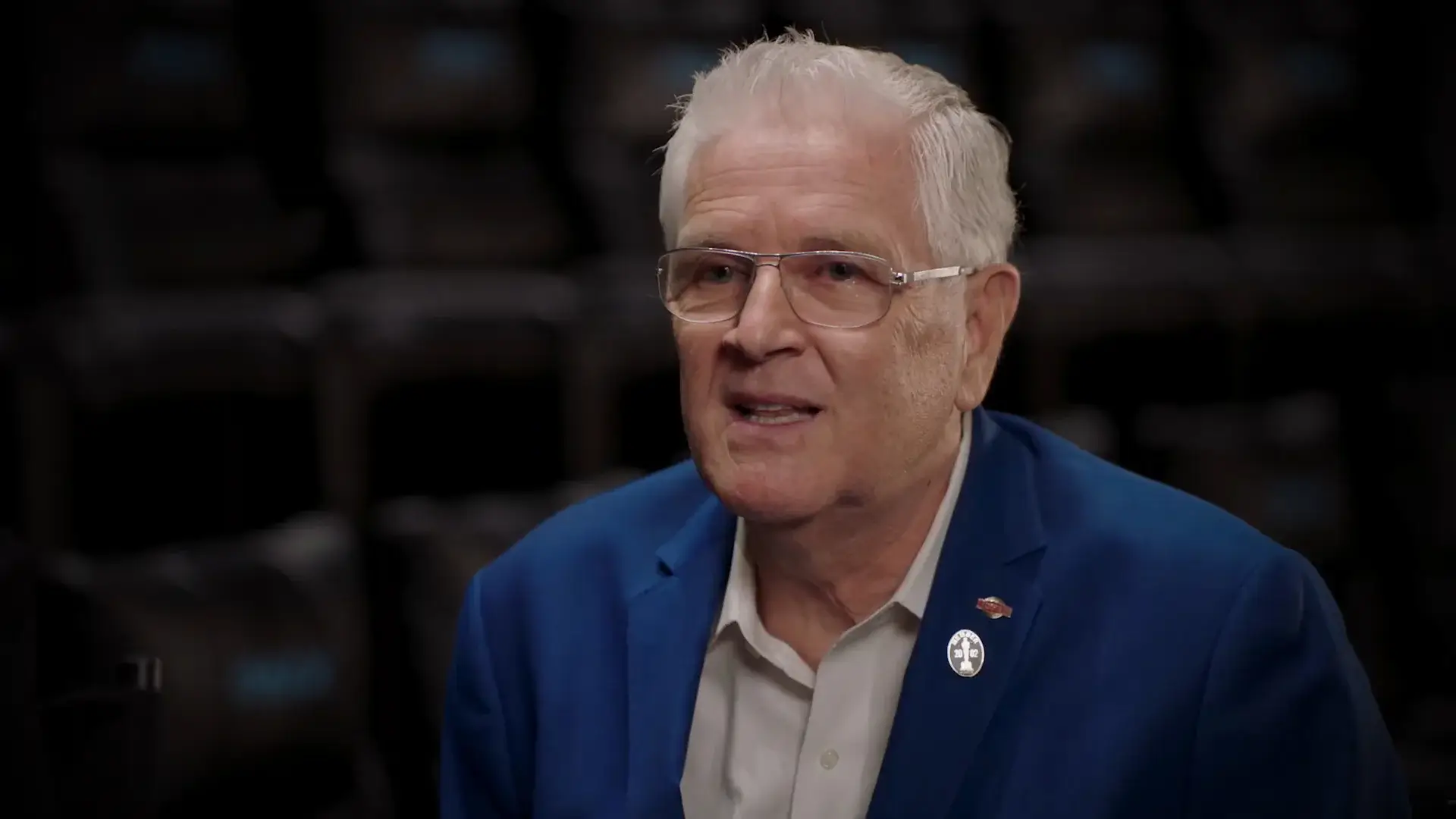 David Keighley smiles in conversation during an official IMAX video.