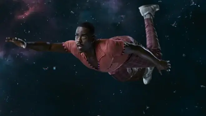 A concerned Ncuti Gatwa floats through space in a press shot from Doctor Who, Season 15.
