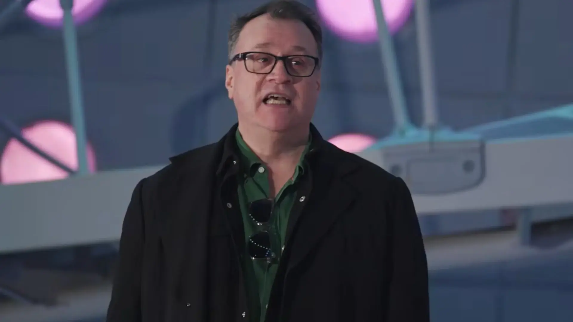 Russell T Davies stands in conversation in the TARDIS in an episode of Doctor Who - The Whoniverse Show.