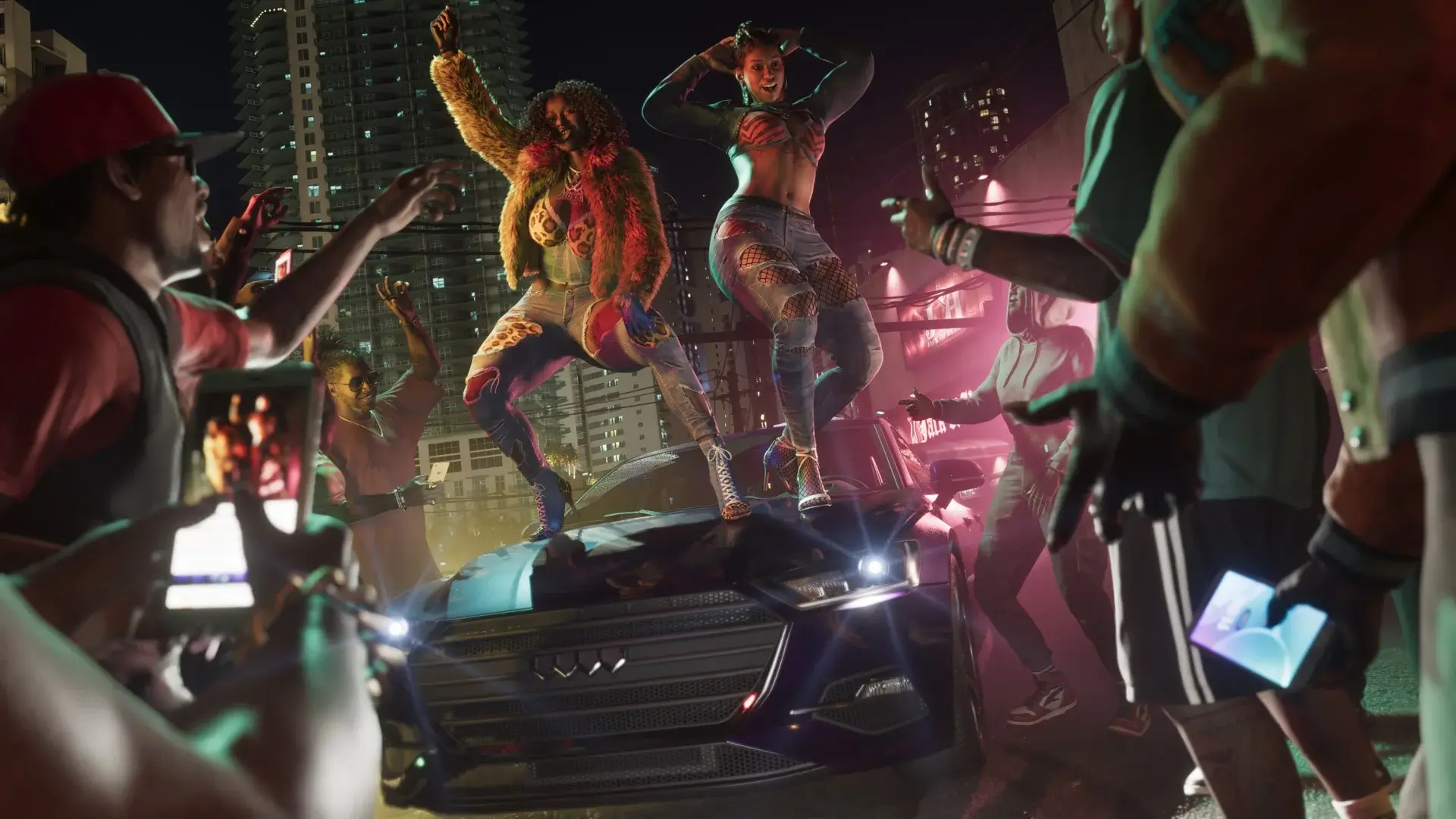 Two members of the Real Dimez crew dance on top of a car while fireworks go off in Grand Theft Auto VI.