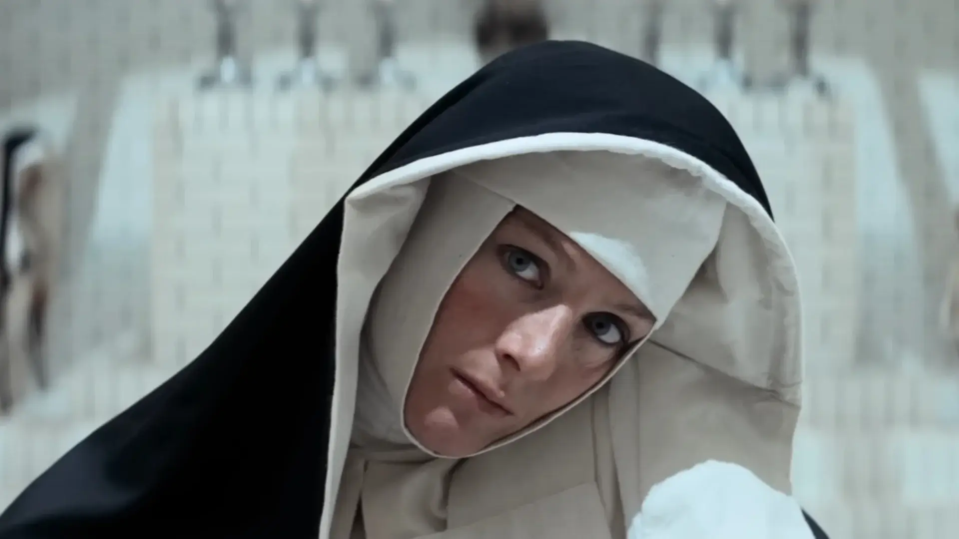 Vanessa Redgrave cocks her head while looking forward, dressed in a nun's habit in Ken Russell's The Devils.