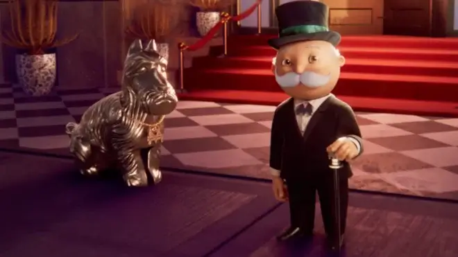 Mr. Monopoly stands happily next to the Dog in front of a fancy hotel in Monopoly.