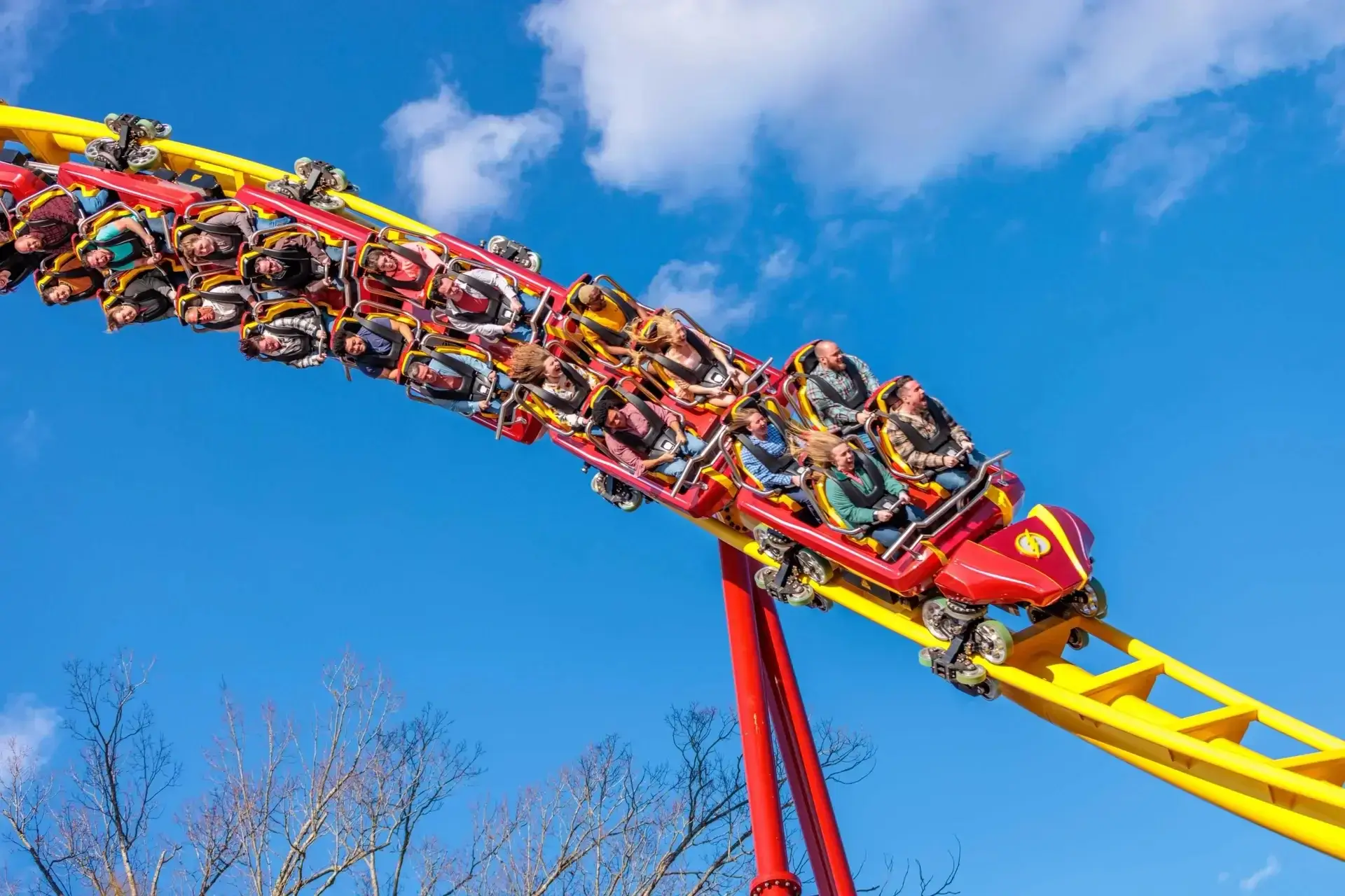 Six Flags Great Adventure's official photo of The Flash Vertical Velocity coaster in motion, full of excited riders.