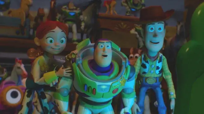 Jessie, Buzz, and Woody stare ahead happily at a glowing Lily in Toy Story 5.