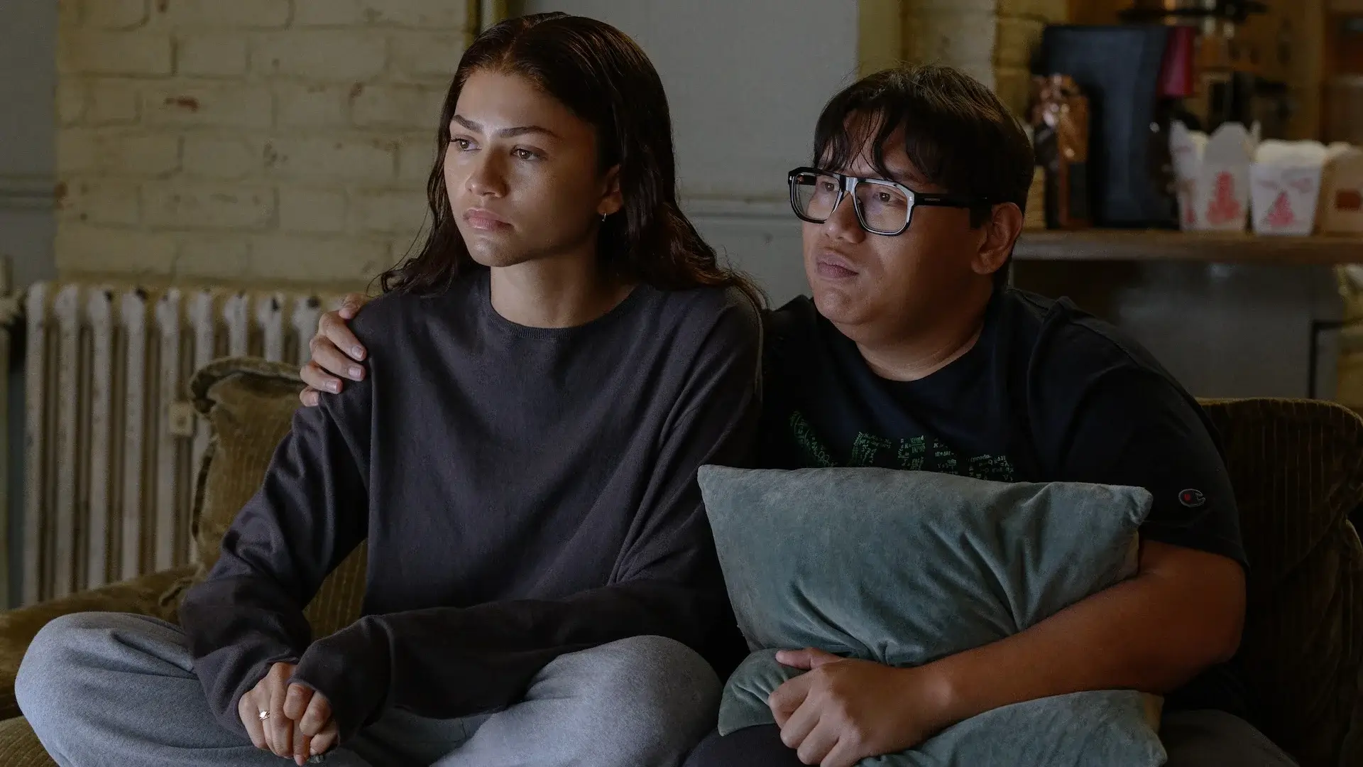 two people sitting together