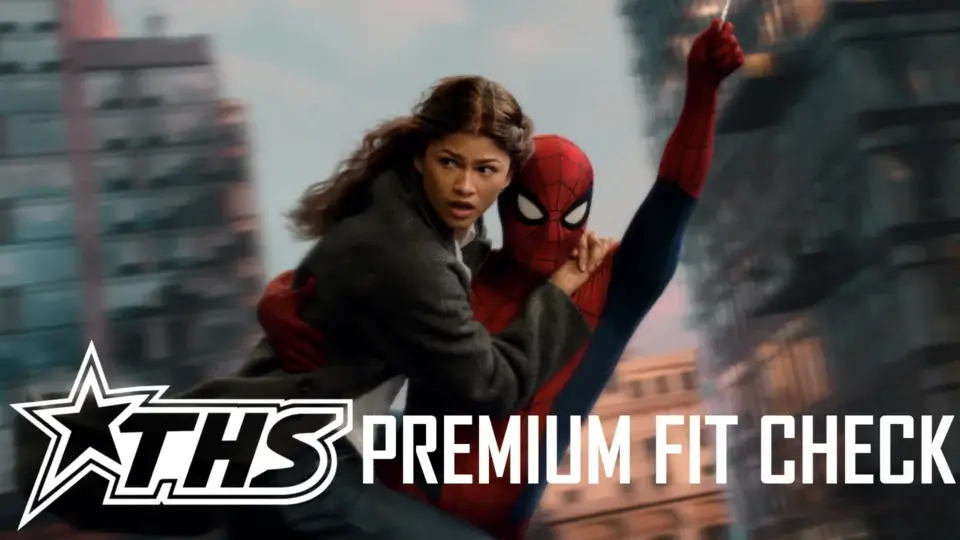 Zendaya looks over with worry as a costumed Tom Holland swings with her in his arms, in Spider-Man: Brand New Day.