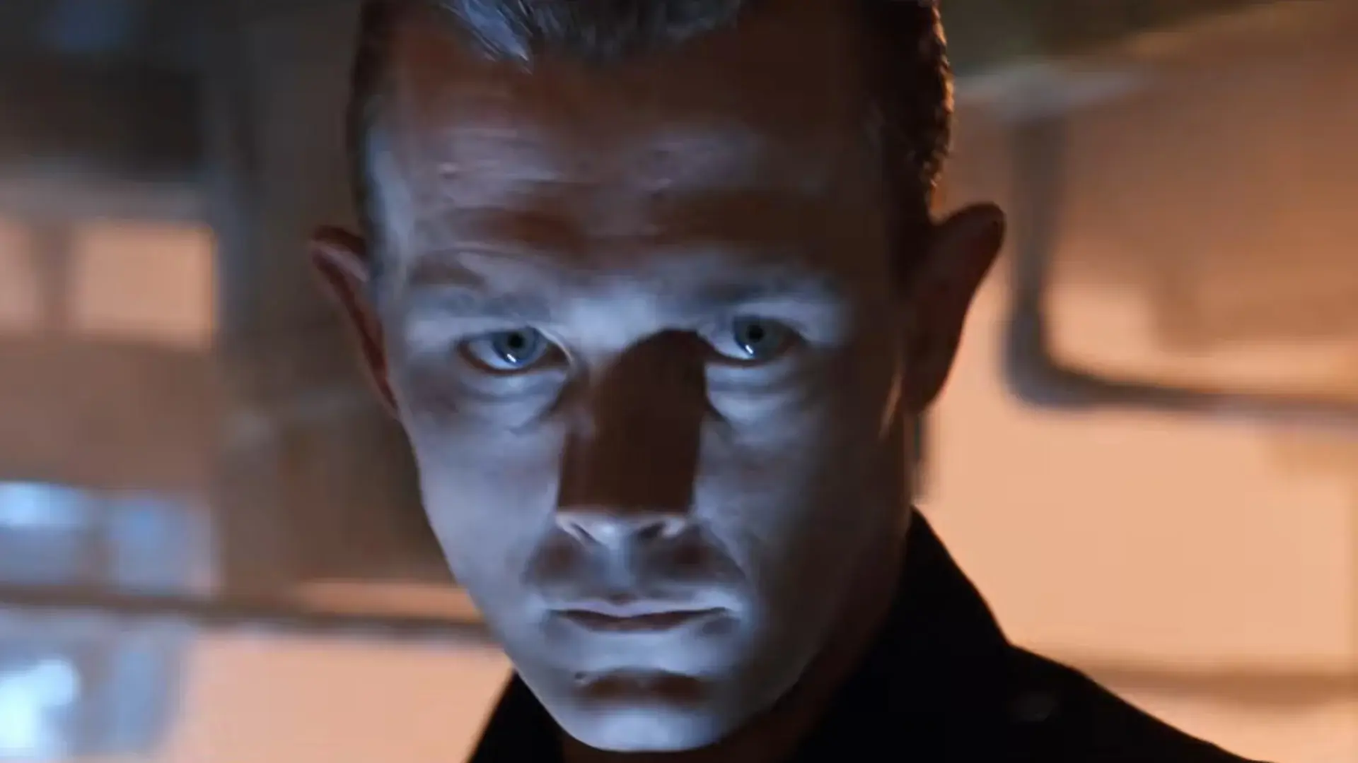 Robert Patrick stares ahead menacingly in a steel foundry in Terminator 2: Judgment Day.