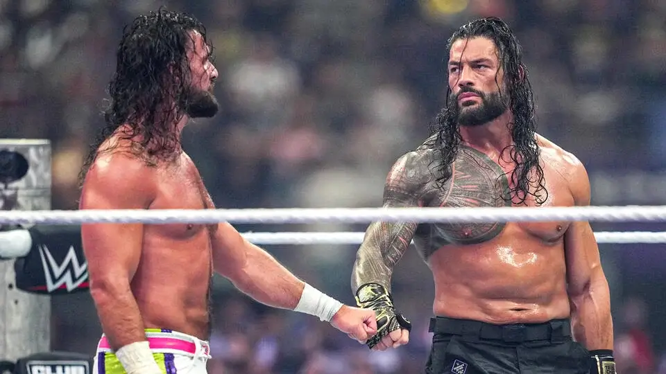 Seth and Roman fist-bump.